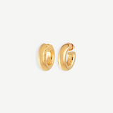A pair of Donut Pierced Hoops, small and chunky gold earrings crafted from 14kt gold plate with a 1-inch diameter, displayed against a plain white background.