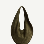 The Market Tote Bag is a dark olive green, crescent-shaped suede bag featuring a single wide strap, shown against a plain white background.