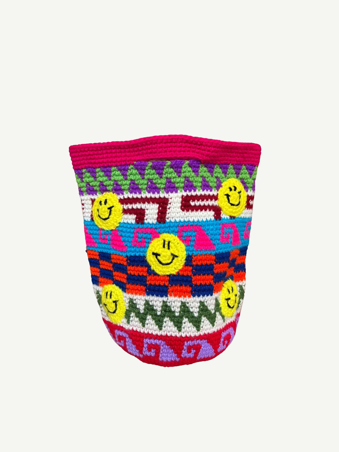 The Smileys Bag is a colorful crochet wool bag featuring geometric patterns in red, blue, purple, green, and pink, adorned with multiple yellow smiley faces on a white background. This unique handmade accessory brings a cheerful touch to any outfit.