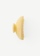 KABE SHOP INC Midi Heirloom claw clip in translucent cream Italian acetate with a curved double-walled design.