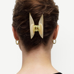 KABE SHOP INC Midi Heirloom hair claw in cream Italian acetate worn in a brown updo hairstyle