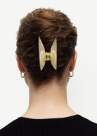 KABE SHOP INC Midi Heirloom hair claw in cream Italian acetate worn in a brown updo hairstyle