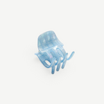 KABE SHOP INC mini claw hair clip in translucent light blue Italian bio-acetate with a subtle grid pattern