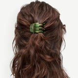 KABE SHOP INC mini claw hair clip in green striped Italian bio-acetate worn in wavy brown hair