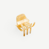 KABE SHOP INC handcrafted mini claw hair clip in a translucent beige marbled Italian bio-acetate finish.