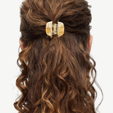 KABE SHOP INC mini claw hair clip in beige Italian bio-acetate holding half-up curly hair