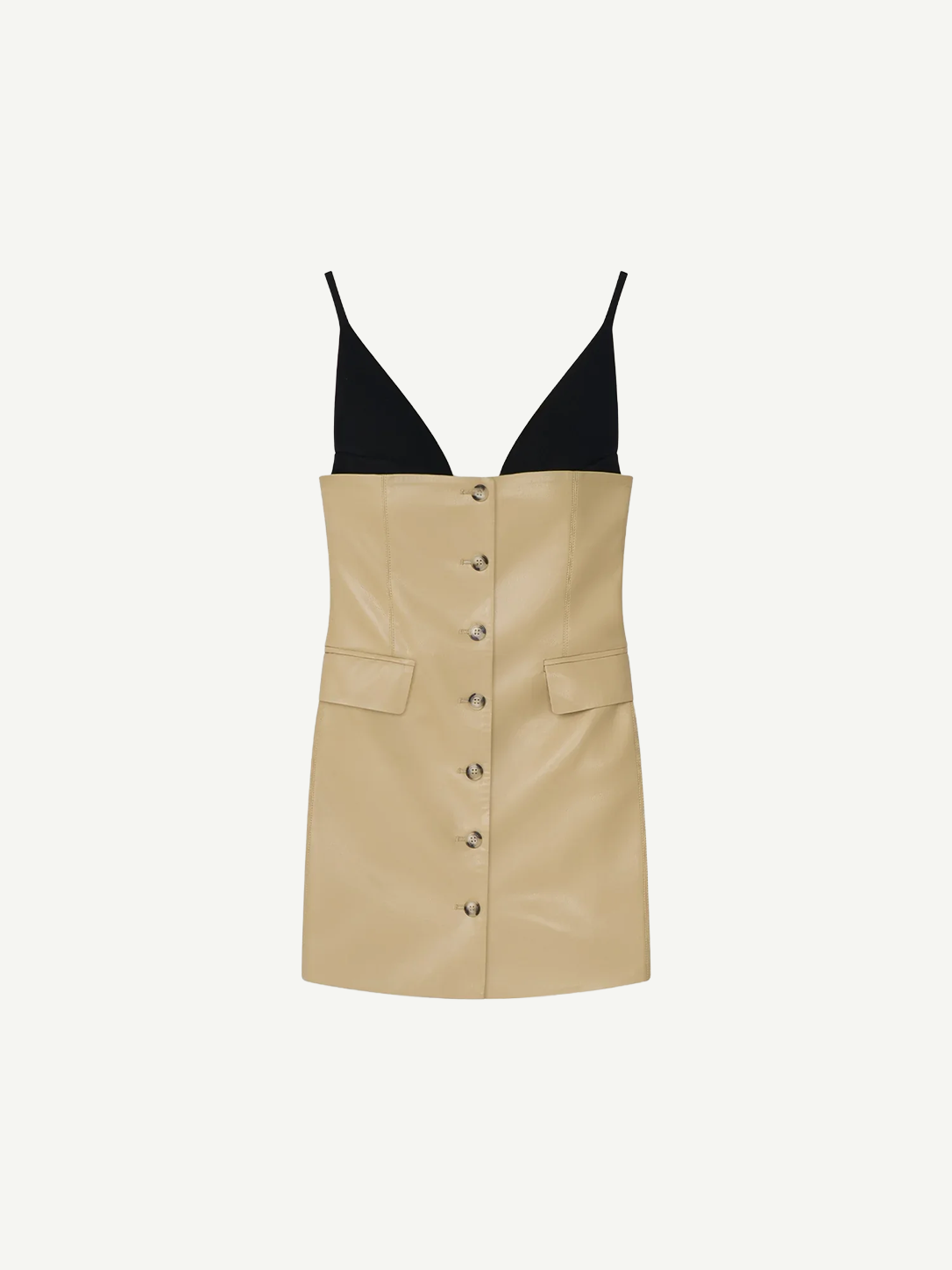 The Zyana Dress is a sleeveless mini with a bold fabric-blocked design, pairing a deep black V-neck bodice and thin black straps with a beige faux leather buttoned skirt and front pockets for a flattering mini silhouette.