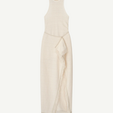 The Rayen Dress is a sleeveless, cream-colored cotton-linen dress with a high neckline and a wrap-style skirt accented by fringed hem details, shown flat against a white background.