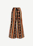 KABE SHOP INC Nera high-waisted wide leg pants featuring a brown, black, and cream tribal-inspired ikat print.