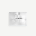 KABE SHOP INC white porcelain incense holder shaped like sculptural lips with a bohemian 1960s Paris aesthetic.