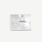 KABE SHOP INC white porcelain incense holder shaped like sculptural lips with a bohemian 1960s Paris aesthetic.