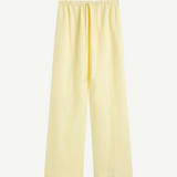 Leiden Relaxed Pant in pale yellow, featuring a wide-leg fit and a relaxed drawstring waist for effortless summer dressing.