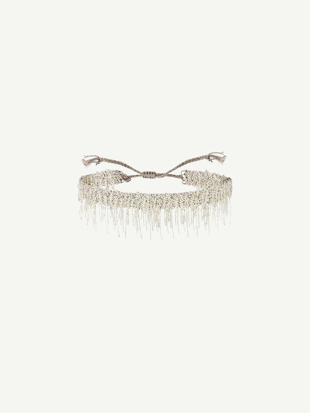 N° 675 Silver Bracelet featuring a delicate design with dangling chain fringe and an adjustable braided clasp, offering a subtle touch perfect for everyday wear, displayed against a plain white background.