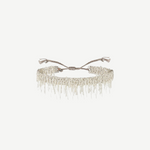 N° 675 Silver Bracelet featuring a delicate design with dangling chain fringe and an adjustable braided clasp, offering a subtle touch perfect for everyday wear, displayed against a plain white background.