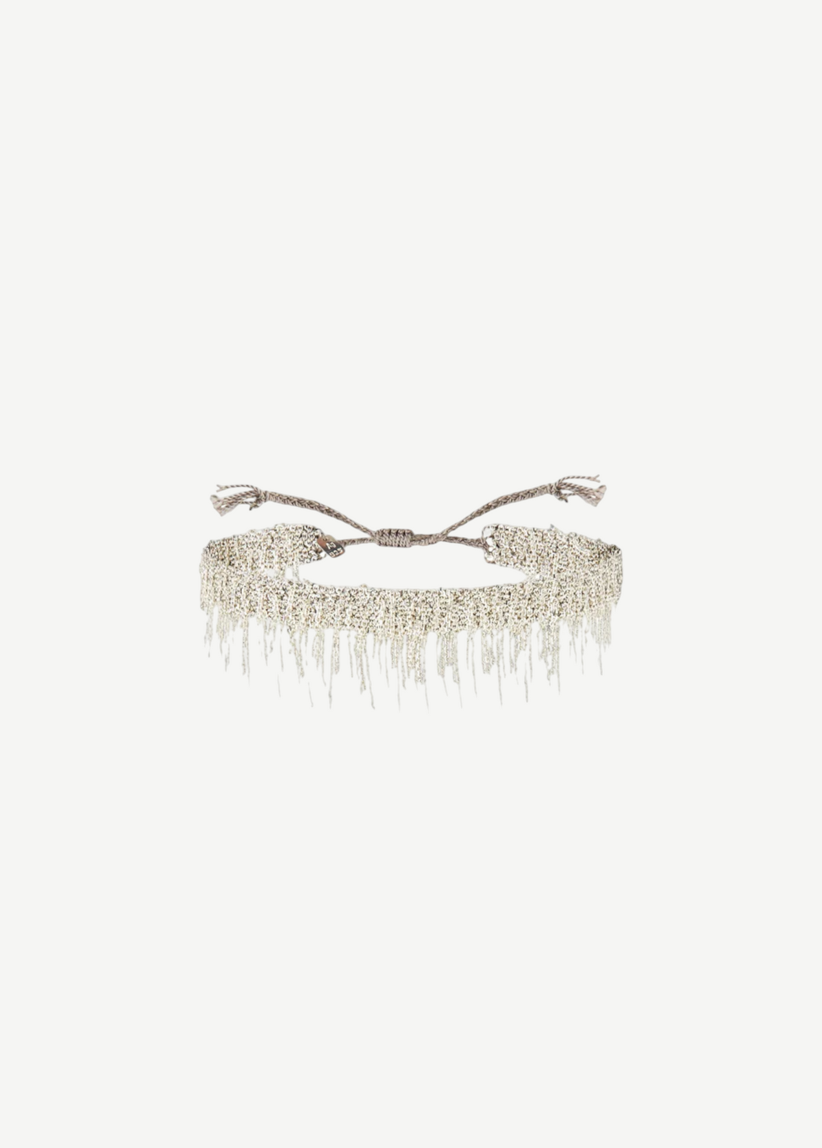 N° 675 Silver Bracelet featuring a delicate design with dangling chain fringe and an adjustable braided clasp, offering a subtle touch perfect for everyday wear, displayed against a plain white background.