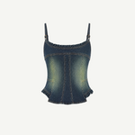 Denim Corset Top with a sculptural silhouette, spaghetti straps, and ruffle accents along the neckline and hem.