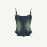 Denim Corset Top with a sculptural silhouette, spaghetti straps, and ruffle accents along the neckline and hem.
