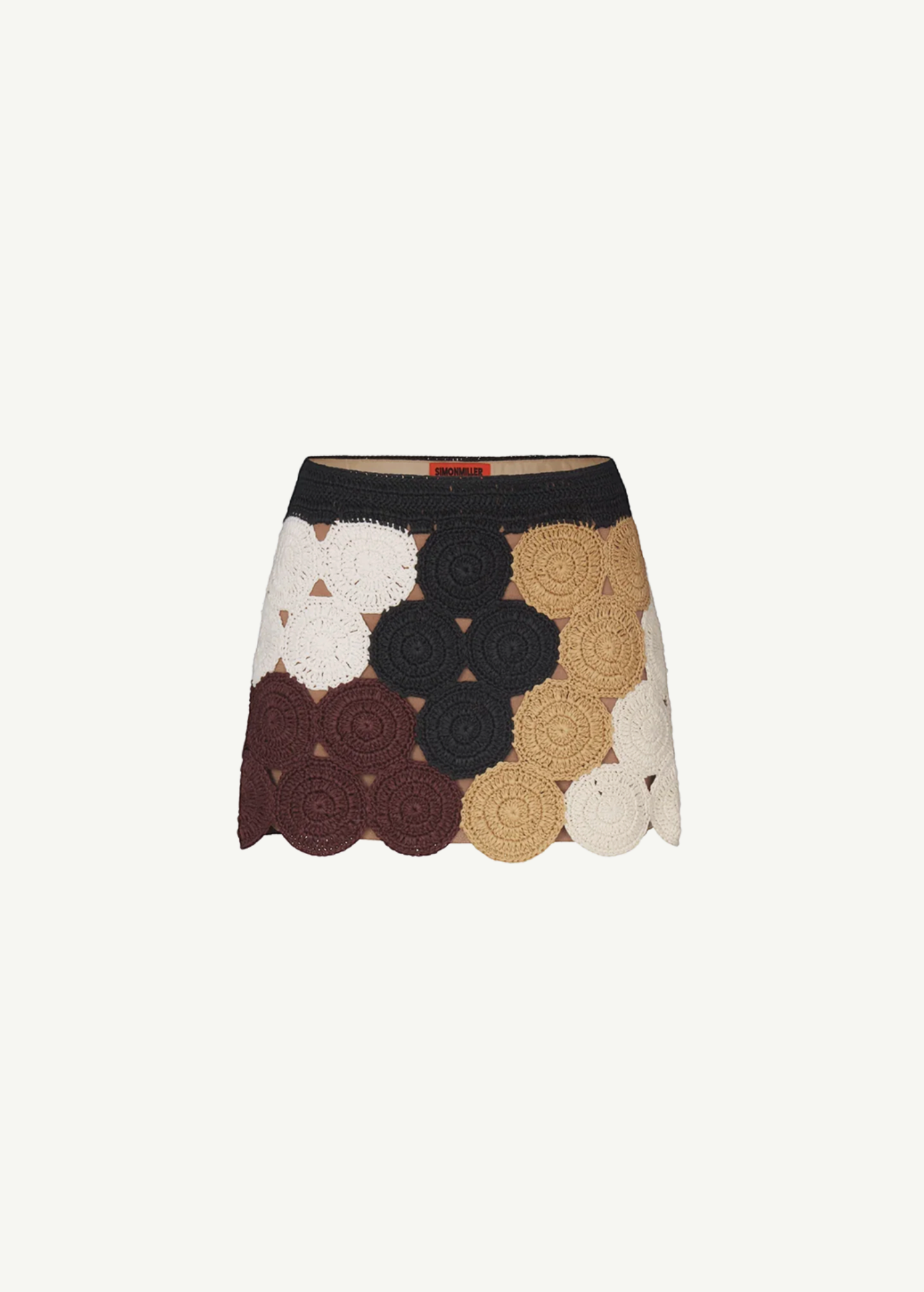 KABE SHOP INC Beep Beep mini skirt featuring hand-knit crochet circular motifs in earth tones with a neutral lining.