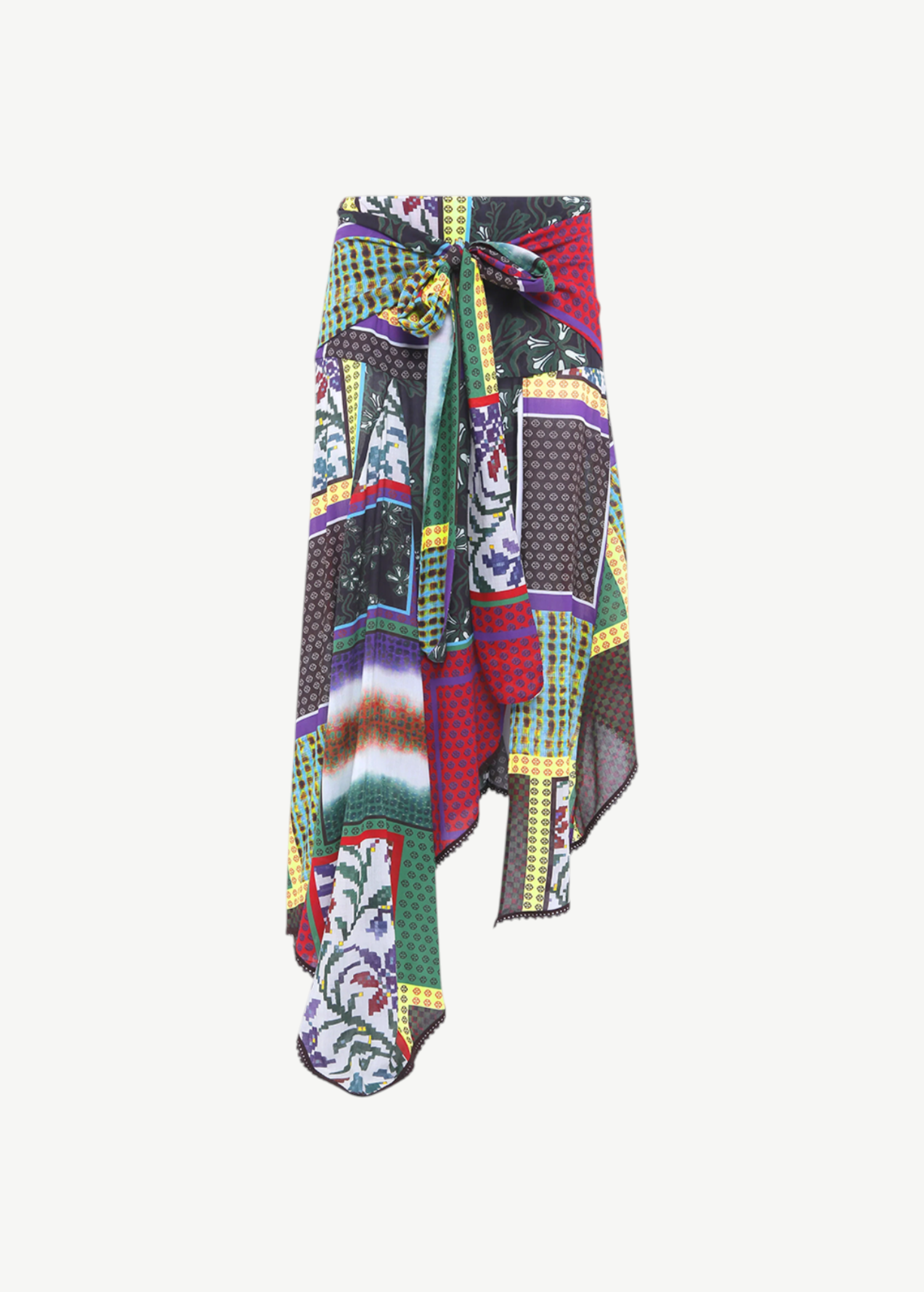 KABE SHOP INC Lumier skirt featuring a vibrant multi-colored patchwork print, asymmetrical hem, and tie-front detail.