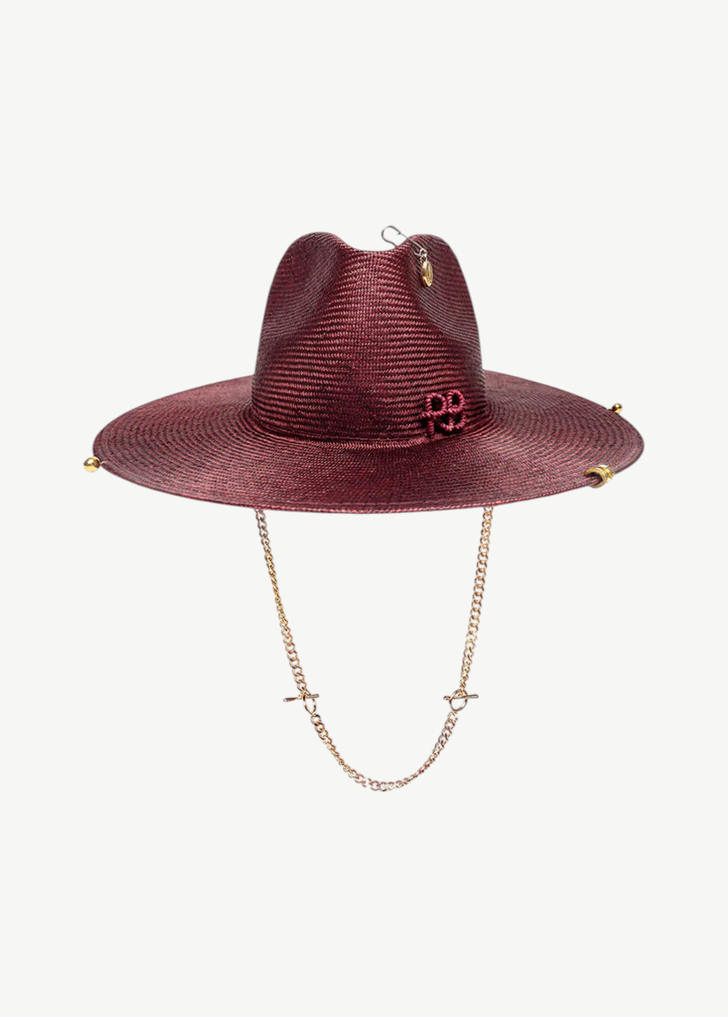 KABE SHOP INC burgundy straw fedora hat featuring a gold chain chin strap and decorative metal accents