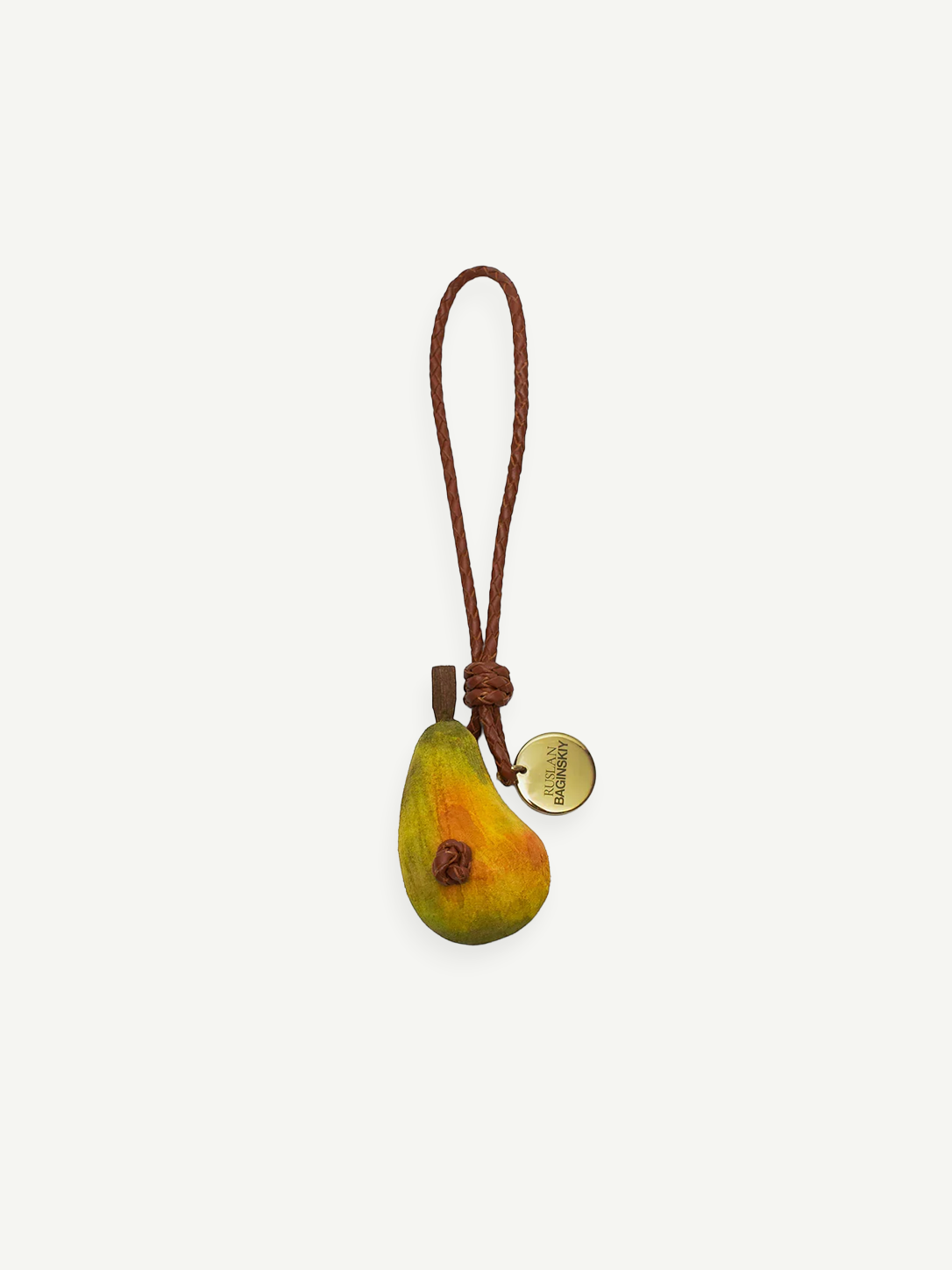 KABE SHOP INC pear-shaped wooden bag charm with a braided leather strap and a gold-tone branded metal tag.