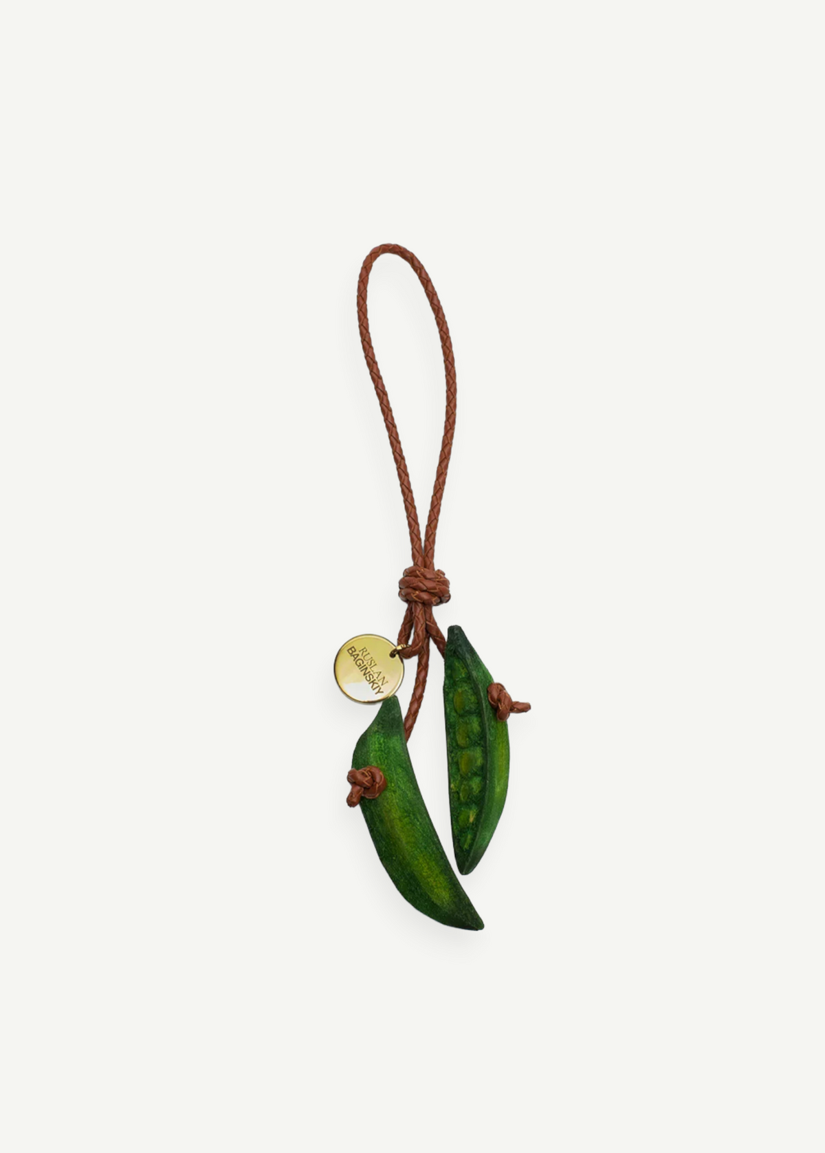 KABE SHOP INC Bag Charm Pea featuring two sculptural green wooden pea pods on a braided brown leather cord with a gold tag