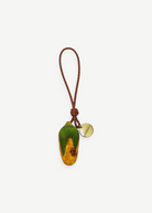 KABE SHOP INC corn-shaped wooden bag charm with a braided brown leather strap and a small gold-tone metal tag.