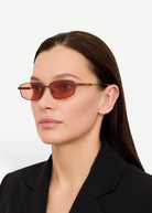 KABE SHOP INC Sera rectangular sunglasses with matte brown stainless steel frames and rose-tinted lenses on a model