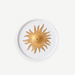 KABE SHOP INC Soleil porcelain incense holder with a gold hand-painted sun motif on a white circular base.