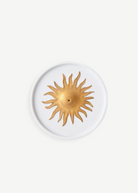 KABE SHOP INC Soleil porcelain incense holder with a gold hand-painted sun motif on a white circular base.
