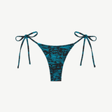 Praia Bottom in blue and black tiger print, an adjustable tie bikini bottom crafted from recycled polyamide for eco-friendly swimwear, displayed on a white background.