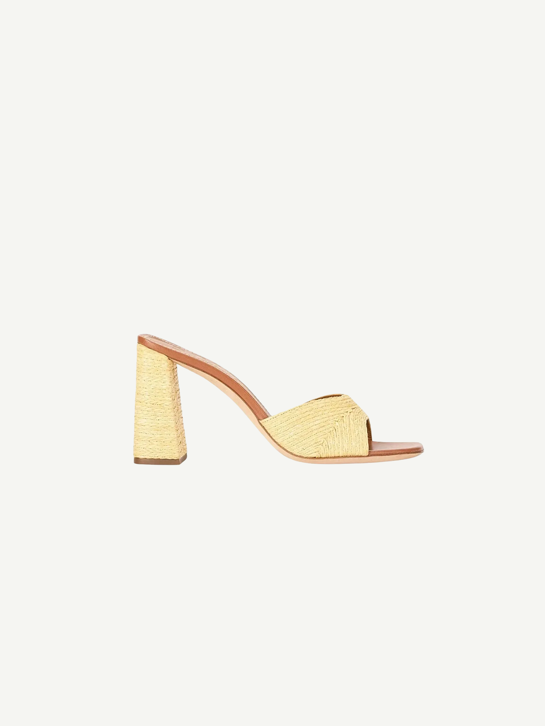The Sloane Heel is a versatile slide sandal featuring a woven raffia-style finish and a sophisticated block heel.