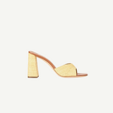 The Sloane Heel is a versatile slide sandal featuring a woven raffia-style finish and a sophisticated block heel.
