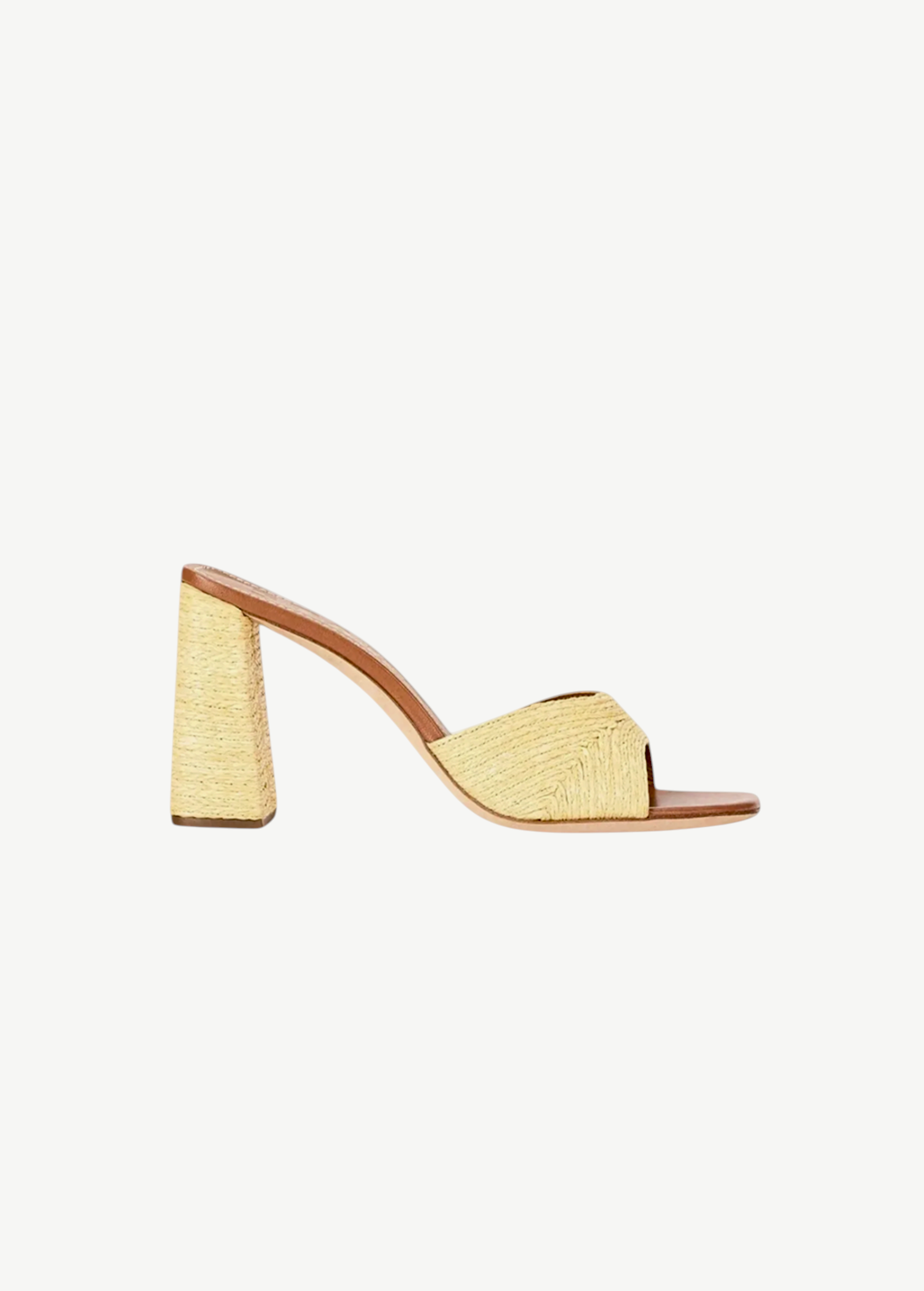 The Sloane Heel is a versatile slide sandal featuring a woven raffia-style finish and a sophisticated block heel.