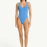 KABE SHOP INC Mara one-piece swimsuit in bright blue with a textured diamond pattern, V-neck, and high-cut leg.