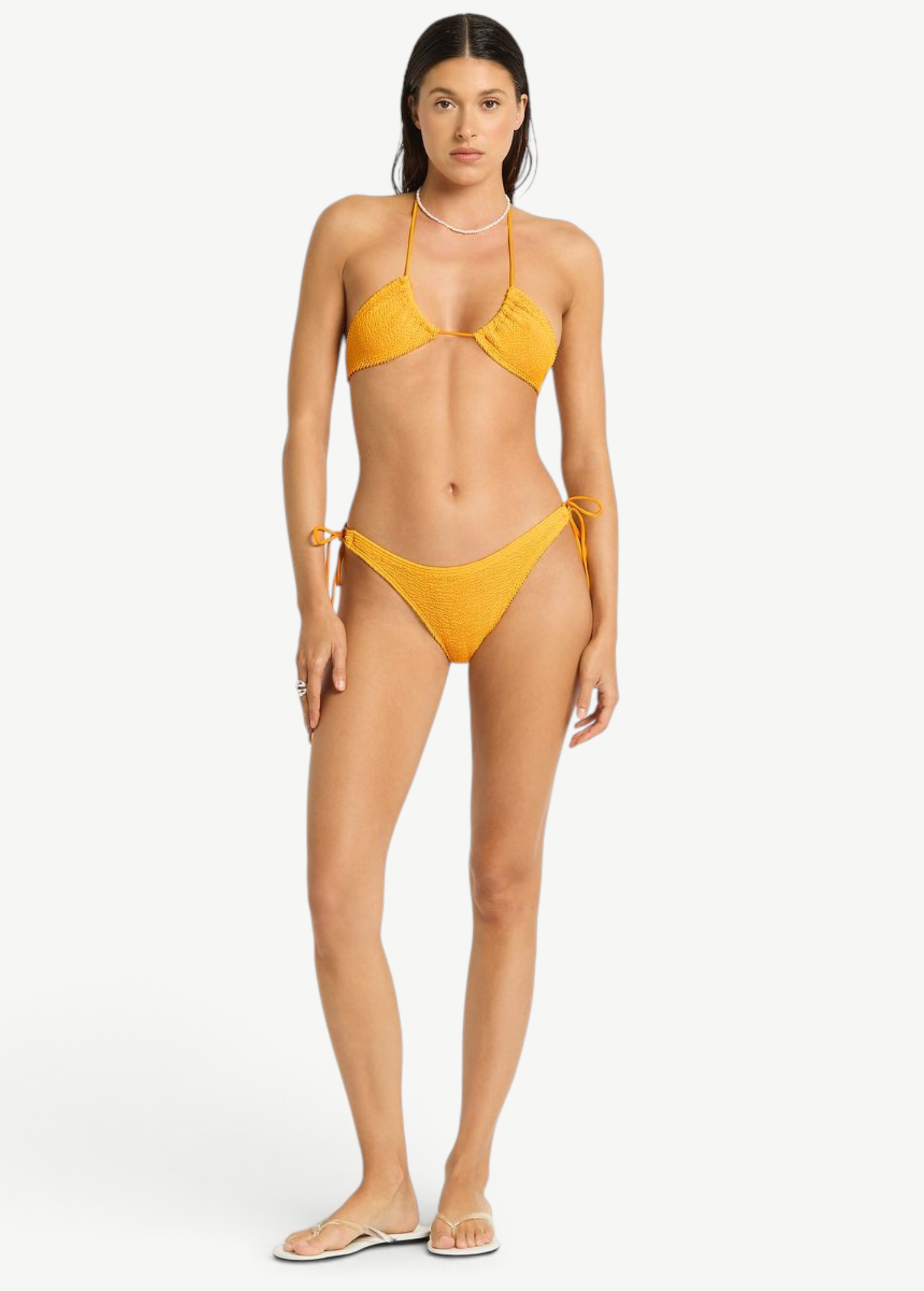 Model wearing KABE SHOP INC Sofie Tri yellow textured triangle bikini set with adjustable side ties