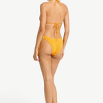 Model wearing KABE SHOP INC Sofie Tri mustard yellow textured bikini set with adjustable tie back from behind