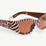 KABE SHOP INC Jacquemus Ovalo sunglasses featuring a brown and white zebra print oval frame with brown tinted lenses