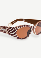 KABE SHOP INC Jacquemus Ovalo sunglasses featuring a brown and white zebra print oval frame with brown tinted lenses