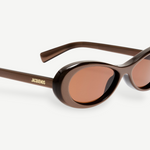 KABE SHOP INC Jacquemus Nuvola sunglasses with a metallic brown oval acetate frame and matching brown lenses.