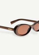 KABE SHOP INC Jacquemus Nuvola sunglasses with a metallic brown oval acetate frame and matching brown lenses.
