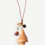 KABE SHOP INC shell necklace featuring a natural conch shell, colorful stone charms, and adjustable leather cord.
