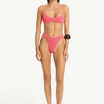 Model wearing KABE SHOP INC Gracie Balconette pink textured bikini set with high-cut bottoms and supportive top