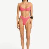 Model wearing KABE SHOP INC Gracie Balconette pink textured bikini set with high-cut bottoms and supportive top