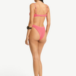 Model wearing a KABE SHOP INC Gracie Balconette pink textured bikini set, back view showing high-cut bottoms.