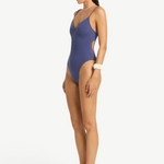 KABE SHOP INC Alana blue underwire one-piece swimsuit with a sleek, supportive fit and high-cut leg on a model.