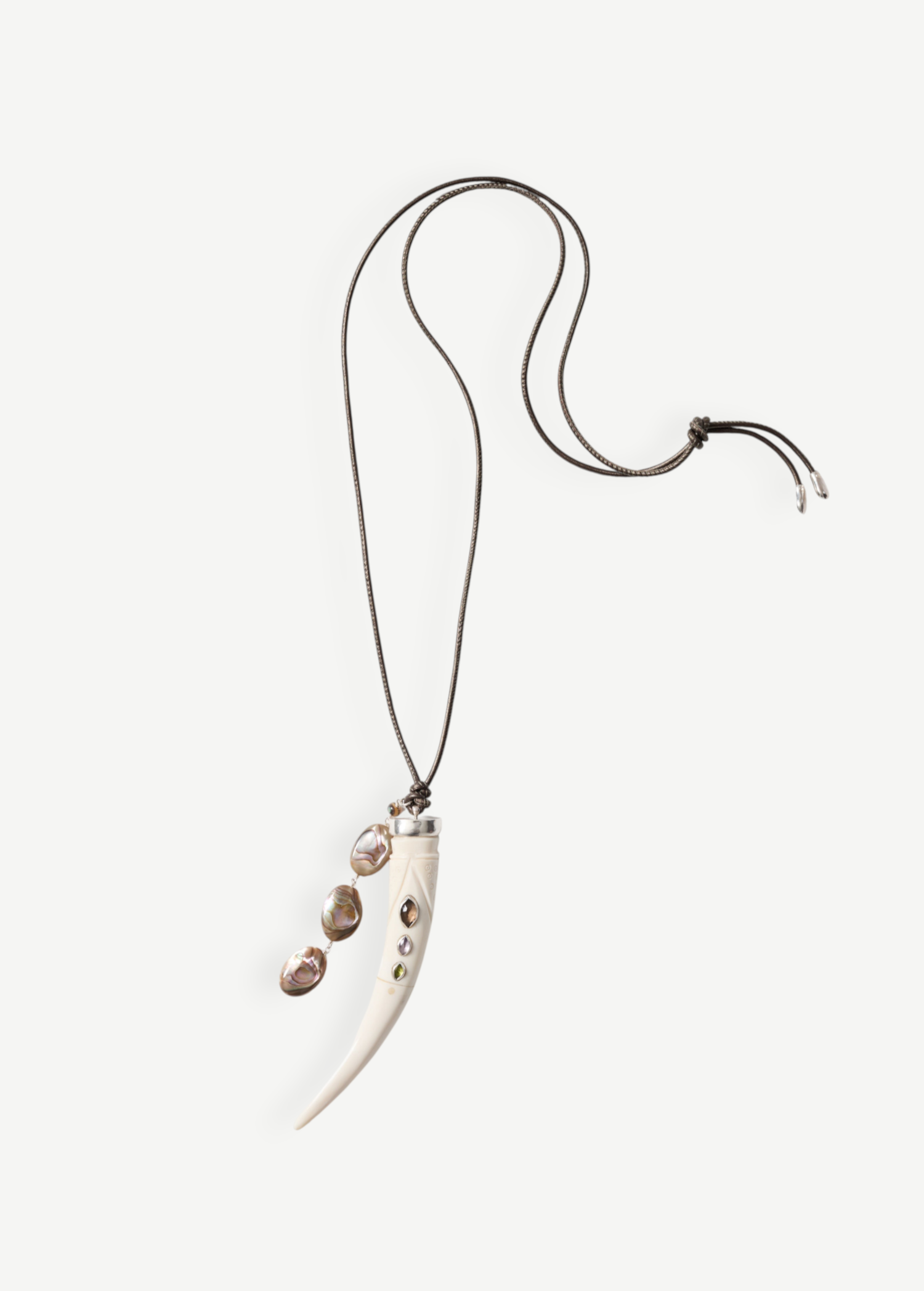 KABE SHOP INC bone pendant necklace with colorful stone inlays and a cascading abalone shell tassel on a brown cord.