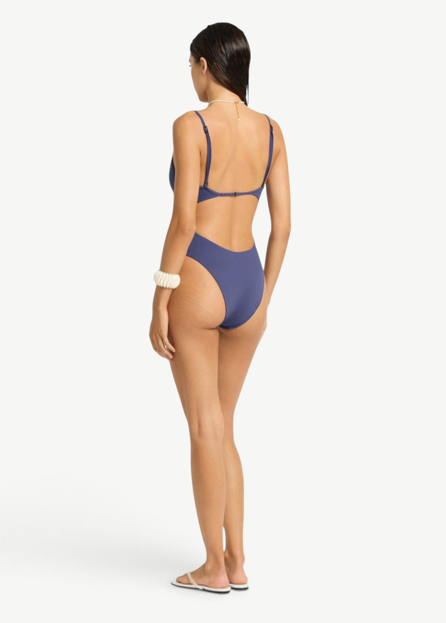 KABE SHOP INC Alana navy blue underwire one-piece swimsuit with a high-cut leg and open back view on a model