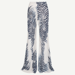 High-waisted, wide-leg Luma Trouser in white with a dark blue palm leaf print, crafted from lightweight viscose georgette.