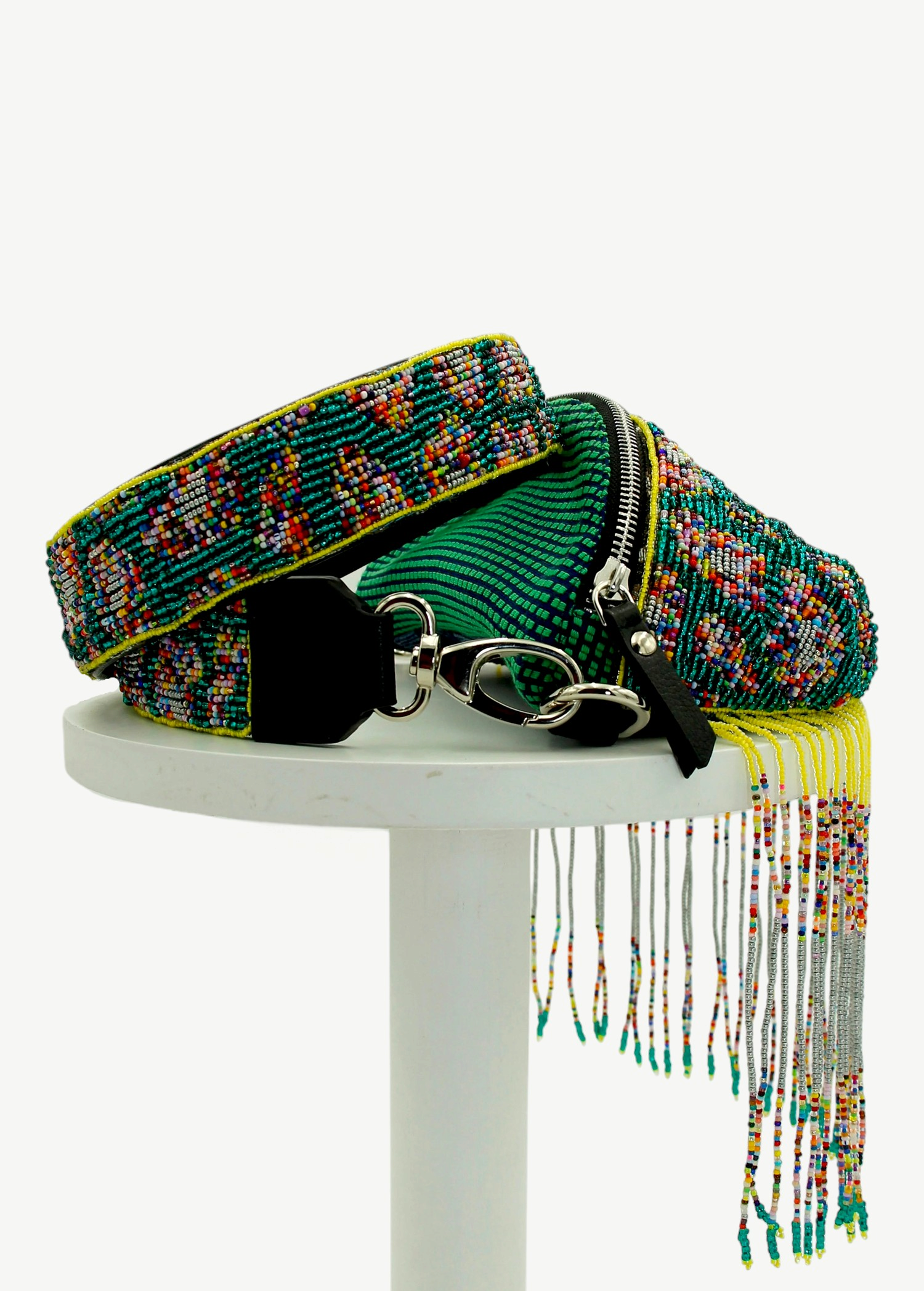 KABE SHOP INC Verdi bag featuring intricate green beaded patterns, a wide strap, and long decorative fringe tassels.
